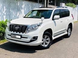 white prado protocol vechile
